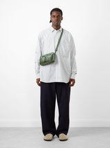 Bio-Nylon TANKER Sling Bag Sage Green by Porter Yoshida & Co. at Couverture and The Garbstore on model