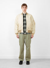 Quilted Bomber Waxed Cream by Stussy at Couverture and The Garbstore on model 